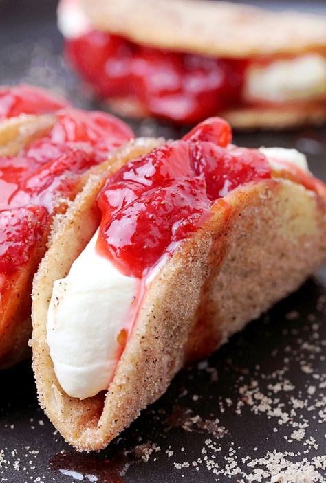 Strawberry Cheesecake Tacos - crunchy cinnamon and sugar tortilla shells, filled with cheesecake and topped with homemade strawberry sauce are perfect bites for every occasion. They are so easy to make, they look great and taste even better.  Strawberry season is about to begin and that makes me really happy, because I love them, especially strawberry desserts. The first thing that comes to my mind when someone mentions strawberries is spring and that makes me feel really good. There are plenty Strawberry Cheesecake Tacos, Cheesecake Tacos, Authentic Mexican Desserts, Taco John's, Dessert Taco, Churro Cheesecake, Homemade Strawberry Sauce, Tortilla Shells, Recipes Authentic