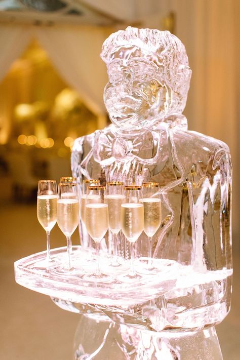 real wedding photo at four seasons los angeles at beverly hills ice sculpture butler with champagne flutes on ice tray Champagne Ice Sculpture, Wedding Ice Sculpture Ideas, Ice Sculpture Centerpiece, Wedding Reception Ice Sculpture, Christmas Ice Sculptures, Ice Sculptures Wedding, Wedding Sculpture, Wedding Ice Sculpture, Ice Sculpture Drink Luge