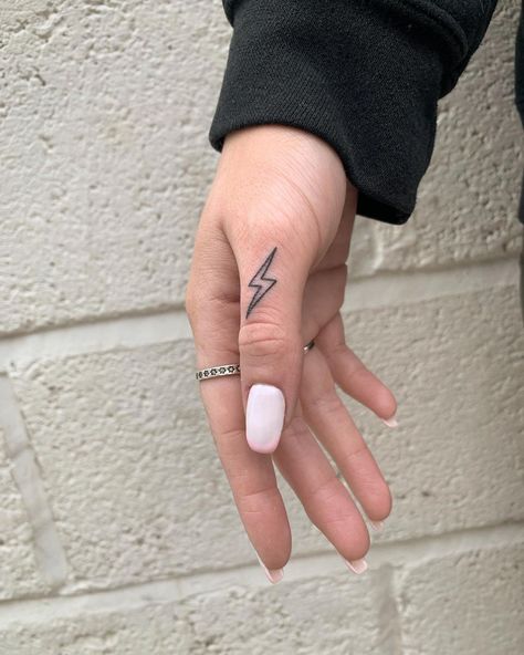 Lightening Bolt Hand Tattoo, Finger Tattoos Lightning Bolt, Finger Lightning Tattoo, Lightening Bolt Tattoo On Finger, Small Western Hand Tattoos For Women, Country Finger Tattoos, Lightning Bolt Hand Tattoo, Linewife Tattoos, Western Dainty Tattoos