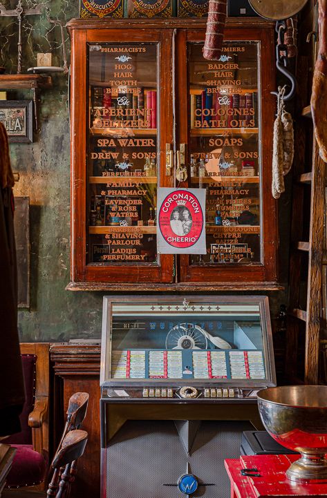 As well as an assortment of pharmacy display cases we supplied the original pharmacy display bottles and jars to stock them with. This includes a wide variety of books and encyclopaedias along with other prints and memorabilia to add interest in every corner and on every wall. In a space like this, more is more and there are curiosities mounted on every available wall and cabinets brimming with vintage ephemera. Modern Apothecary Aesthetic, Jib Door, Apothecary Aesthetic, Modern Apothecary, Vintage Shop Display, Beveled Glass Doors, Shop Counter, More Is More, Spa Water