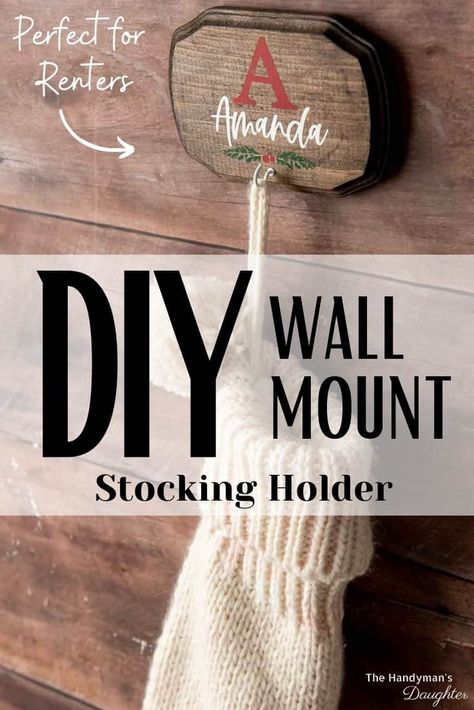 No place to hang stockings this Christmas? No problem! This DIY wall mount stocking holder can go anywhere! Personalize each stocking hanger for every member of the family! Wall Mounted Stocking Hanger, Wall Stocking Hanger, Diy Stocking Hangers For Wall, Stockings Hung On Wall, Wall Stocking Holder, Diy Stocking Hanger, Diy Stocking Holder For Wall, Hang Stockings On Wall, Hanging Christmas Stockings No Fireplace