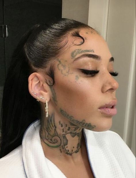 Over Eyebrow Tattoos For Women, Tattoo On Side Of Face By Ear, Small Face Tattoos For Women Above Eyebrow, Feather Face Tattoo, Face Tattoo Above Eyebrow, Over Eyebrow Tattoo, Loyalty Face Tattoo, Side Of The Face Tattoo, Jaw Tattoo Face