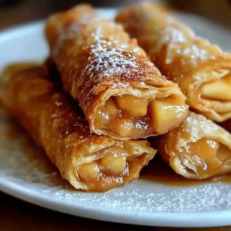 Discover how to make irresistible apple pie egg rolls, a unique twist on classic desserts. Learn tips, tricks, and variations for this crispy, sweet treat! Apple Pie Eggroll, Eggrolls Recipe Easy Chicken, Apple Pie Eggrolls Recipe, Sweet Potato Egg Rolls, Apple Egg Rolls Recipes, Sweet Eggrolls, Egg Roll Desserts, Cheesecake Egg Rolls Recipe, Sweet Egg Rolls