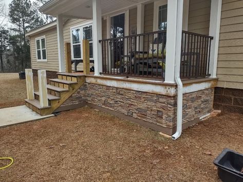 Thinking of updating your porch? Try using our faux stone as a DIY skirting project for your front porch. It can make a huge difference. Raised Porch, Porch Skirting, Stone Porch, Double Wide Manufactured Homes, Front Porch Stone, House Skirting, Faux Wood Wall, Stacked Stone Panels, Brick Porch