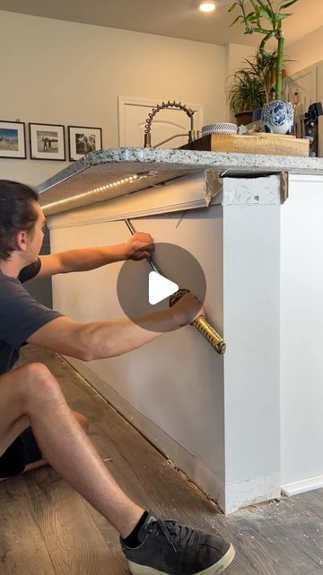 Kelly Lopez on Instagram: "I wish these wood panels were cheaper 😂🪚🪵

#diyprojects #woodpaneling #woodwall #accentwall #kitchenisland #diyideas" Wood Slats Island Kitchen, Wood Panel On Kitchen Island, Tile Kitchen Island Base, Wood Panel Kitchen Island, Bead Board Ideas, Wood Panel Island, Pole Wrap Kitchen Island, Kitchen Gate Design, Kitchen Island Wood Paneling