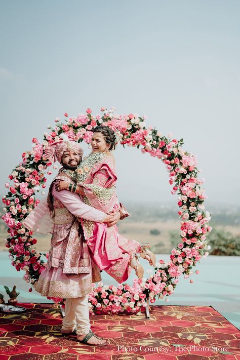 Varmala ceremony, floral setup ideas, pink floral decor ideas, circular floral decor, bride and groom in pink, indian wedding moment, outdoor mandap decor, Indian wedding traditions, outdoor wedding decor, elegant wedding setup, coordinating bride and groom, Maharashtrian bride, varmala inspiration, wedding decor inspiration, minimalistic mandap ideas, bridal inspo Mandap Decor Indian, Outdoor Mandap, Varmala Ceremony, Sufi Night, Pink Floral Decor, Cocktail Decoration, Set Decoration, Mandap Decor, Photography Couple