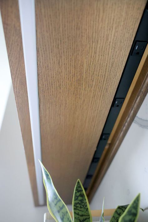 A close-up shot of a black outlet strip under light wood custom cabinetry Under Cabinet Outlets Kitchen, Black And White Oak Kitchen, Hidden Kitchen Outlets, Outlets Under Cabinets, Under Cabinet Outlets, White Oak Kitchen Cabinets, Cabinet Outlet, Kitchen Outlets, White Oak Kitchen