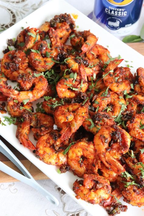 A simply delicious Mangalorean Prawn Chilli Fry, where the King Prawns are first marinated with a simple home-style chilli spice marinade and delicately fried until just tender. The prawns are then given an oomph by tossing them in an aromatic garnish of sauteed onions, ginger, green chilli and curry leaves. No hunting down hard to find ingredients in this must try Prawn Chilli Fry. Prawn Fry Indian, Prawn Starters, Prawn Fry, Prawn Fish, Fried Prawns, Chilli Spice, Prawns Fry, Chilli Prawns, Sauteed Onions