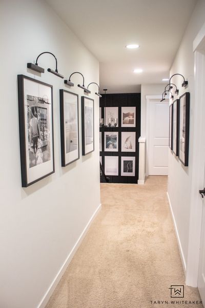 Spruce up your boring hallway with this Black and White Hallway Gallery Wall using personal pictures and wireless sconces! #hallwaydecor #hallwayideas #gallerywall Black And White Hallway, Beige Hallway, Hallway Pictures, Hallway Gallery Wall, Gallery Wall Staircase, Hallway Gallery, White Hallway, Staircase Makeover, Gallery Lighting