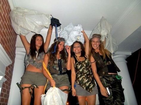 America Party. Homemade Paratrooper Costumes with Parachute. Camo clothes, army tools from dollarstore halloween costumes, vinyl table cloth and string. tie the string to the parachute and then stuff it into the bag. Camping Theme Party Outfit, Camo Frat Party Outfit, Jungle Frat Party Outfit, Camo Dress Up Day At School, Army Costume Halloween, Camo Party Outfit, Camo Theme Outfit, Camo Outfits Spirit Week, Camo Spirit Day Outfit