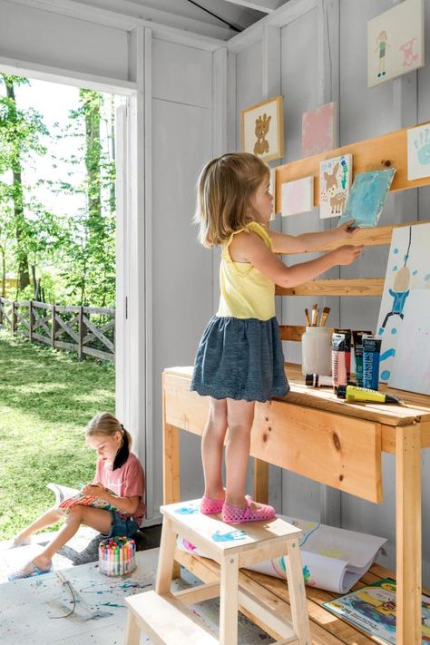 Adorable Arts and Crafts Shed for Kids | HGTV Art Area For Kids, Art Shed, Craft Shed, Paint Buckets, Art Essentials, Art Area, Potting Bench, Hanging Paintings, Ceiling Hanging