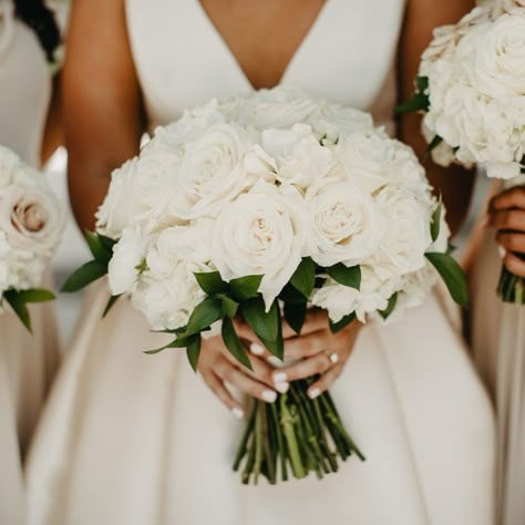 Madison’s elegant white rose wedding bouquet was the perfect wedding flower arrangement for her classic and elegant wedding aesthetic. Simple white rose bridal bouquet complemented the timeless wedding décor. We offer luxury wedding planning in Nashville and worldwide. White bridal bouquet, white wedding florals, classic wedding bouquet Classic White Rose Bridal Bouquet, Simple Bridal Bouquet Roses, White Roses Bride Bouquet, White Fall Wedding Flowers, Classy Wedding Bouquet, Brides Bouquet White, Bridesmaid Flower Bouquets, Rose Bride Bouquet, Pink Bouquet Flowers