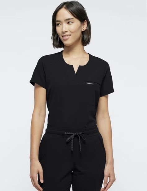 Women's Scrubs, Cute Scrubs & Medical Uniforms | Jaanuu Black Scrubs Outfit, Nurse In Scrubs, Nurse Fashion Scrubs, Bust Dart, Medical Scrubs Outfit, Pharmacy Store, Scrubs Outfit, Scrubs Uniform, Branding Shoot