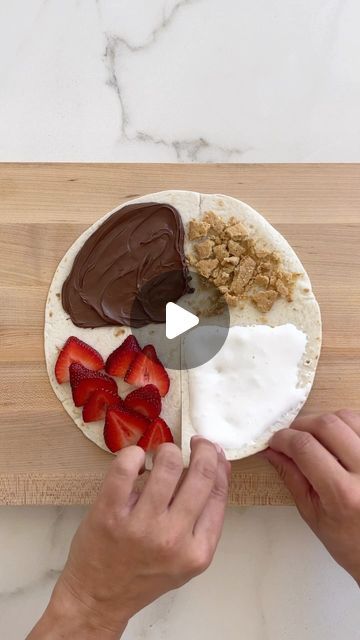 Kelly Senyei | Just a Taste® on Instagram: "TORTILLA WRAP HACK: S’MORES EDITION! 🔥

Bring the s’mores indoors by sandwiching marshmallow fluff, crushed graham crackers, creamy Nutella and sliced strawberries inside a tortilla. Toast it in melted butter then give it a good cinnamon-sugar shower for summertime flavor in every bite! 🙌🏻

👉🏻 COMMENT with the word TORTILLA and I’ll DM you the clickable recipe link for all of my wrap hack variations!

#tortilla #cookinghacks #smores #smoresseason #nutella #tortillawrap #smore" Tortilla Wrap Recipes Desserts, Desserts Using Tortilla Wraps, Nutella Wraps Tortillas, Snacks With Tortillas, Tortilla Wrap Dessert Recipes, Sweet Tortilla Recipes, Dessert Tortilla Wrap, S’mores Tortilla, Smores Dessert