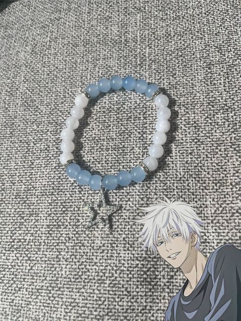 "Show off your Jujutsu Kaisen fandom with this stylish beaded bracelet featuring Satoru Gojo! Each bead is carefully crafted to reflect Gojo's iconic look, making it a must-have for any fan. Perfect for adding a touch of anime flair to your outfit. Follow us on TikTok @beadbab3 for more unique creations!" Jjk Bracelet, Gojo Bracelet, Anime Bracelet, Dragon Ball Wallpaper Iphone, Anime Jewelry, Pretty Phone Cases, Necklace Tutorial, Dragon Ball Wallpapers, Diy Bracelets Patterns