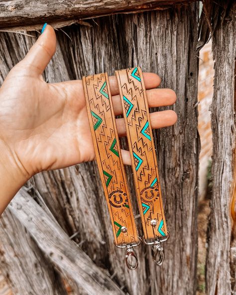 A moment for these handcrafted wristlets 😍 ✨ . Customs are currently closed, but check out the website for some of the ready to ship leather wristlets! . #western #horseshoejco #customleatherwork #leatherwristlet #cowgirlfashion #westernboutique #westernlifeandstyle #westernwear #tooledleather #customleatherworks Western Leather Purse Straps, Bronc Halter Noseband Custom, Tooled Leather Headstall, Western Camera Strap, Custom Leather Work, Southwestern Hand-tooled Brown Belt Buckles, Western Boutique, Camera Strap, Leather Wristlet