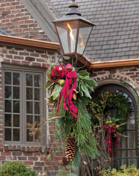 How to Decorate Your Exteriors for the Holidays Diy Lamp Post, Post Christmas Decor, Outdoor Lamp Post, Christmas Lamp Post, Christmas Lamp, Light Pole, Christmas Swags, Christmas Porch, Noel Christmas