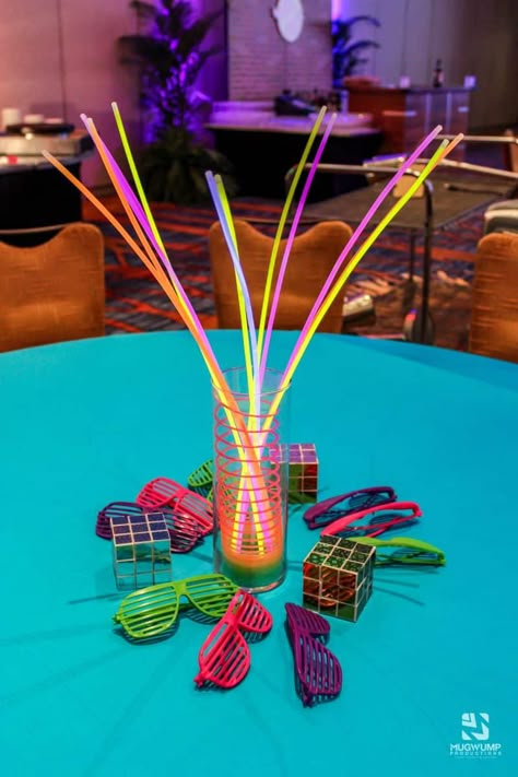 1980s - Event Planning in Jacksonville and Daytona Beach FL 80 Centerpieces 80s Theme, 80s Prom Fundraiser, 80s Party Decorations Outdoor, 80s Prom Table Decorations, Neon 50th Birthday, 80s Table Setting, 80s Theme Party For Men, 80s Party Decorations Centerpieces, 1980s Table Decorations