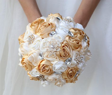 PRICES MAY VARY. 【Size】Diameter: 8.7inch/22cm, Height: 10.2inch/26cm. 【Material】 Made of satin roses, this bouquet is decorated with golden brooches and bling rhinestones, with handle dotted with bling rhinestones and wrapped with ribbons, which will add elegant and romantic accent to your event. 【Handmade】Every flower and bling detail are handcrafted by skilled artisans. Never faded satin flowers make it possible to keep this bouquet as a keepsake for witness of your romantic wedding or pass do Golden Bouquet Wedding, Flower Bouquet For Bride, Golden Bouquet, Bouquet For Bride, Quinceanera Bouquet, Rose Flower Bouquet, Bridal Wedding Bouquet, Bling Rhinestones, Gold Brooch