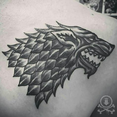 Awesome black and grey dire wolf symbol from Game of Thrones tattoo by Jose Bolorin.  #12ozstudios #team12oz #tattoo #tattoos #tattooart #tattooartist #gameofthrones #direwolf #kingofthenorth #housestark #blackandgrey #tattoosformen #tattoosforwomen Game Of Thrones Wolf Tattoo, Direwolf Tattoo, Jon Snow Tattoo, Dire Wolf Tattoo, Game Of Thrones Wolves, Game Of Thrones Tattoo, Stick N Poke, King In The North, Dire Wolf