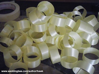 Diy Wedding Napkin Rings, Ribbon Tied Napkins, Ribbon Napkin Rings Diy, Diy Gold Napkin Rings, How To Tie Wedding Invitation Ribbon, How To Tie A Ribbon Bow On Invitation, Diy Napkin Rings Wedding, Elegant Wedding Paper Napkin Rings, Ribbon Napkin Rings