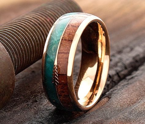 Simple and elegant, this 8mm Dome Shaped Rose Gold Plated Tungsten with Wood and Green Malachite Inlay, will seal your vows on your wedding day. The ring is available from size 5 to 15. The inside of the band is rounded for Comfort Fit. This exquisite ring is a great addition to any attire. It can be worn as a Friendship Ring, Promise Ring, Engagement Ring and Wedding Band.* Width -  8mm* Material - Tungsten Carbide, Rose Gold Plating, Wood, Green Malachite  * Sizes - 5 to 15* Finish - Polished* Green Wedding Band, Green Wedding Rings, Pretty Wedding Rings, Wood Engagement Ring, Wooden Wedding Bands, Wooden Wedding Ring, Wedding Ring For Him, Rustic Wedding Rings, Wood Wedding Ring