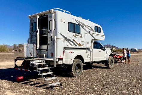 Truck Camper 101: Basics for Newbies and Beginners | Truck Camper Adventure Truck Slide In Camper, Truck Camper Hacks, Truck Camper Storage Ideas, Truck Camper Storage, Camper Stairs, Truck Camper Interior, Diy Truck Camper, Camper Storage Ideas, Camper Equipment