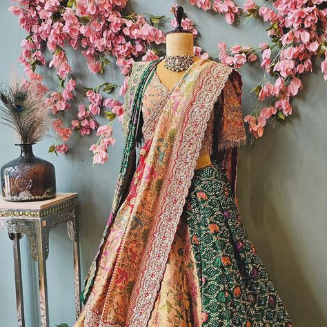 Presenting our luxurious Kanchi Gold Lehenga with stunning bird motifs, paired with a gorgeous Patan Bandhej dupatta featuring an intricately detailed heavy border To complete the look, we’ve styled it with a green Patan Bandhej saree and an embellished blouse for that perfect festive charm. ✨Shop this exclusive look at KKASHI, Road Number 10, Banjara Hills, Hyderabad, or visit us online at www.kkashi.in. For inquiries, reach us on WhatsApp at +91-6304505317. #KanchiGoldLehenga #BandhejE... Bandhej Dupatta, Bandhej Saree, Gold Lehenga, Bird Motif, Embellished Blouse, Number 10, Chaniya Choli, Hyderabad, Lehenga