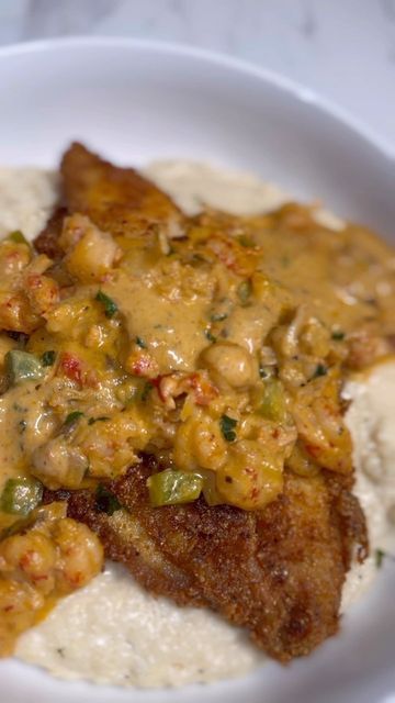 Chef Cordarrius Green on Instagram: "Y’all had Sundee dinner yet or y’all still in church? 👀 Catfish & Grits GRAB THE COOKBOOKS ON AMAZON THRU THE LINK IN BIO FULL STEP BY STEP RECIPE IS ON YOUTUBE (link in bio) Ingredients 4 catfish fillets 1/2 lb frozen, cooked crawfish tails 1 cup grits 1 cup yellow cornmeal 1 cup all purpose flour 2-3 cups heavy cream 2-3 cups chicken broth 1 stick unsalted butter 1/2 cup diced bell peppers 1/2 cup diced red onion Mustard (for binding) Hot sauc Smothered Catfish, Recipes With Crawfish Tails, Fried Catfish With Cream Sauce, Catfish Atchafalaya Recipe, Catfish With Crawfish Sauce, Catfish Acadiana Recipe, Stuffed Catfish Recipes, Fried Fish And Grits, Southern Fried Catfish Soul Food