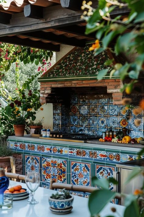 Elevate your patio with chic outdoor kitchen tile ideas that merge style and durability for the ultimate hosting space. Get inspired! Outdoor Bbq Tile Ideas, Italian Outdoor Kitchen Ideas, Talavera Outdoor Kitchen, Hacienda Outdoor Kitchen, Moroccan Outdoor Kitchen, Spanish Tiles Outdoor, Boho Outdoor Kitchen, Mexican Outdoor Kitchen Hacienda Style, Italian Tile Kitchen