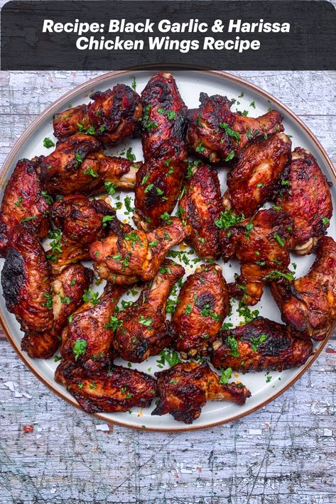 These chicken wings are finger-licking good! You can grill them in the oven or on the barbecue. Black garlic is made by ageing regular white garlic, which gives it a delicious sweet and savoury taste. Combine it with harissa paste and you’ve got yourself a flavour bomb of a marinade. Honey Lime Salmon, Garlic Wings, Garlic Chicken Wings, Harissa Chicken, Garlic Honey, Tomato Risotto, Garlic Marinade, Grilled Chicken Wings, Lime Salmon