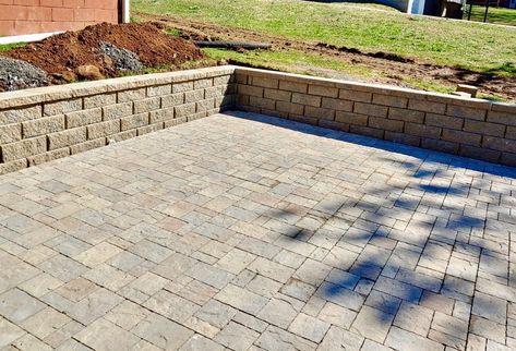 Installed a Belgard paver patio and paver wall for this homeowner. The stone we used is Belgard 3 Piece Laffit paver in the Savannah color. Paver Patio With Retaining Wall, Retaining Wall Patio, Paver Edging, Belgard Pavers, Paved Patio, Paver Stones, Concrete Bench, Driveway Design, Backyard Renovations