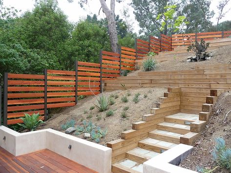 Hillside Redwood fence | tkostructure Fence On A Hillside, Fencing On A Hill, Fencing Ideas For Sloped Yard, Sloped Fence Ideas, Fence On A Hill, Hillside Fence, Backyard Hill Landscaping, Steep Gardens, Backyard Fence Decor