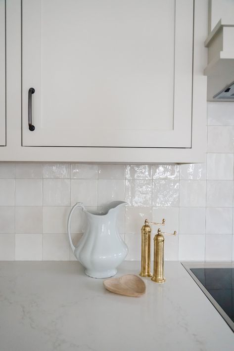 This kitchen goes for a light, monochrome color palette to make the space feel open, with a gorgeous, creamy zellige tile backsplash that adds texture and luxury to the space. White Zellige Tile Kitchen, White Zellige Tile Backsplash, Zellige Tile Kitchen Backsplash, Zellige Tile Kitchen, White Zellige Tile, Zellige Tile Backsplash, Light And Bright Kitchen, Monochrome Kitchen, Kitchen Renos