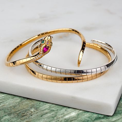 This artistically designed silver snake bangle bracelet for women is wreathing softly around your wrist thanks to its high-quality curved optics. The snake’s skin is interpreted in a graphical-modern way. The power animal’s head is decorated with various facetted glass-ceramic stones, synthetical red corundum and sparkling zirconia in multiple colours which are added by hand. #thomassabo #magicbyTS #snake #jewellery #snakejewellery Rings Snake, Snake Jewellery, Snake Bangle, Snake Rings, Power Animal, Magic Garden, Art Of Seduction, Snake Jewelry, Mystical Art