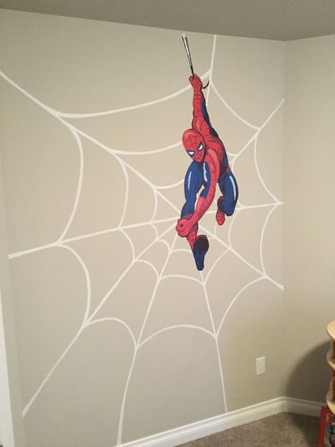 DIY superhero wall art! Handpainted spider web with Pottery Barn Kids Spiderman decal. I dry-brushed flat white paint (our trim color) using a small flat brush. Start by painting the diagonal lines from the center point of the web and extend the lines (do not have to be perfect) to where you want them to stop. Then draw the curved lines inside. Wait for paint to dry before applying any decals. Tip: practice drawing spider webs on paper before you paint. Boys Spiderman Bedroom, Men Room Decor Ideas, Spiderman Wall Art Diy, Spiderman Wall Painting, Spiderman Mural Bedroom, Spiderman Wall Mural, Superhero Bedroom Wall Paint, Spiderman Wall Sticker, Spiderman Room Decor