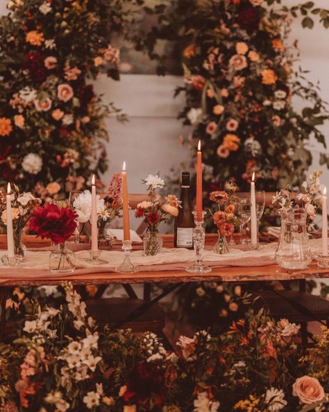 A rich autumnal palette creates for a romantic and modern wedding atmosphere 🍂💫 A canopy of lush foliage, flickering candles, and elegant blooms brought an intimate, cosy atmosphere to life, wrapping the day in timeless romance. Soft neutrals paired with rich burgundies, deep reds, soft peaches, and vibrant oranges - a seasonal colour combo that’s elegant, timeless, and utterly swoon-worthy. The pièce de résistance? The whimsical ceremony arch, beautifully repurposed as a stunning backdro... Whimsical Ceremony, Late September Wedding, Talavera Wedding, Vintage Glam Wedding, Luxury Florists, Wedding Flower Inspiration, Flickering Candles, Ceremony Arch, September Wedding