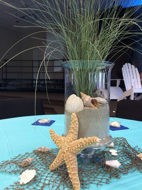 Starfish Centerpiece Ideas, Beach Retirement Party Decor, 60th Birthday Beach Theme, Coastal Dinner Party Table Settings, Beach Theme Dinner Table, Outdoor Ocean Party Decorations, Under The Sea Decorations Centerpieces, Beach Themed Centerpieces Diy, Beach Theme Party Table Decor