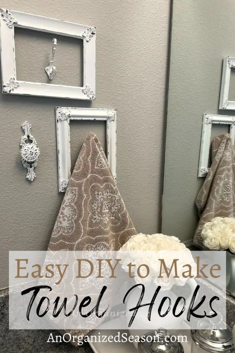 Give your bathroom a unique look and make DIY towel holders! This tutorial will teach you how to make a towel hook with old picture frames and wall hooks. You can also use door knobs or cabinet pulls as hooks! You can modify this to make a towel rack with multiple hooks! DIY towel holders are a great way to spruce up your bathroom! Follow us for more DIY inspiration! Farmhouse Bathroom Hand Towel Holder, Creative Towel Hooks For Bathroom, Diy Towel Rack Bathroom Hanging Ideas, Hand Towel Holder Ideas Diy, Kitchen Towel Rack Ideas, Farmhouse Bathroom Towel Rack Ideas, Diy Towel Holder Bathroom, Towel Hanger Ideas Bathroom, Farmhouse Hand Towel Holder