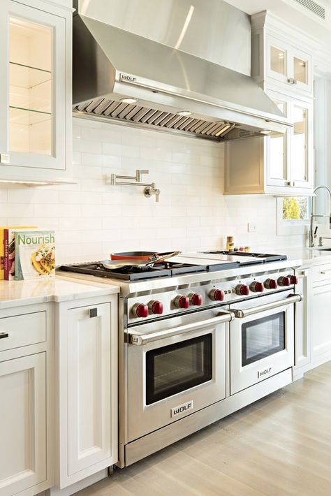 The double oven in the kitchen of a home in Southampton, N.Y. There are a total of three ovens, two warming drawers, three prep areas and two sets of fridge/freezer combinations in the home. Double Oven Kitchen, Double Oven Range, Atlanta Homes And Lifestyles, High End Kitchens, Kitchen Display, Kitchen Oven, Kitchen Stove, Atlanta Homes, Double Oven