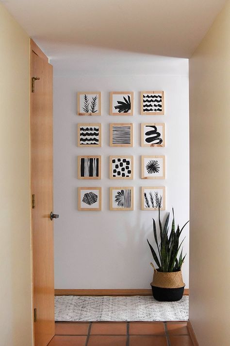 Learn how to create a gorgeous Artistic Hallway Gallery Wall using simple wooden blocks and paint. Add simple black paint and modern patterns to bring a creative, fresh and unique look to your home! Delineate Your Dwelling Bright Hallways, Hallway Artwork Ideas, Hallway Artwork, Hallway Gallery Wall, Hallway Gallery, Hallway Paint, Wooden Artwork, Dekor Diy, Hallway Decor