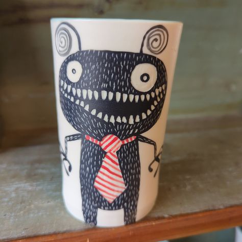 These porcelain cups are hand thrown right here in Deering Center and illustrated with sgraffito monsters. Some have undies, some have ice cream cones, some have tentacles. No two are the same! Approximately 12 oz capacity (because these are hand thrown, slight variations in size are possible) Dishwasher safe Microwave safe Our collection changes frequently so please visit us in person to see which mugs we have today. Please note, extra shipping charges apply for these fragile, one of a kind tre Plant Monster, Sister Songs, Clay Monsters, Holiday Hours, Ice Cream Cones, Porcelain Cup, Crochet Books, Sgraffito, Pottery Ideas