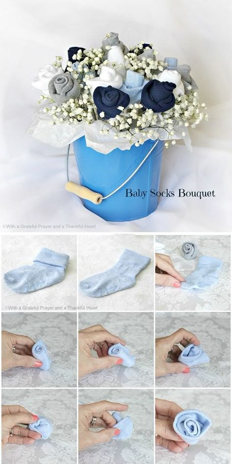 Baby Socks Flower Bouquet Tutorial - could use square boxes wrapped to look like baby blocs in place of pail for each table Baby Socks Flowers, Diy Baby Socks, Baby Sock Bouquet, Socks Ideas, Fiesta Shower, Picture Flower, Hadiah Diy, Idee Babyshower, Boy Baby Shower Ideas