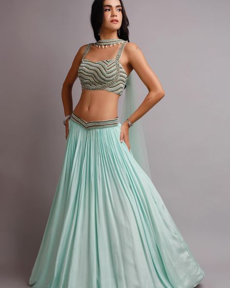 Itroducing our stunning Aqua crepe Lehenga, adorned with intricate crystal embroidery, ensuring you sparkle with every step. Paired with a blouse featuring unique pattern. The lehenga itself boasts a modern touch with a convenient pocket attached, this ensemble exudes elegance and unforgettable statement. Flaunt complete your ensemble with a regal choker dupatta, elevating your look to pure sophistication radiant confidence with enchanting ensemble. Order Now!! For enquiry and Whatzapp cal... Crepe Lehenga, Choker Dupatta, Crystal Embroidery, Unique Patterns, Lehenga, Choker, Order Now, Sparkle, Confidence