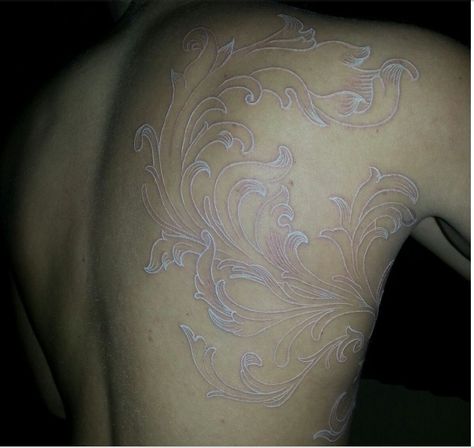 Beautiful white ink tattoo - art nouveau Scarifaction Tattoo, White Tattoo Ideas On Dark Skin, Back Tattoo White Ink, Face Scar Tattoo, White Ink Back Tattoo, Scarification Tattoo Ideas, Light Ink Tattoo, Healed White Tattoo, White Tattoo Healed