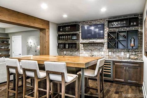 A lower level island with seating for five serves as a great location for an afternoon cocktail or wine tasting. Basement Bar Plans, Basement Bar Designs, Basement Inspiration, Man Cave Basement, Basement Living Rooms, Basement Kitchen, Basement House, Small Basements, Basement Makeover