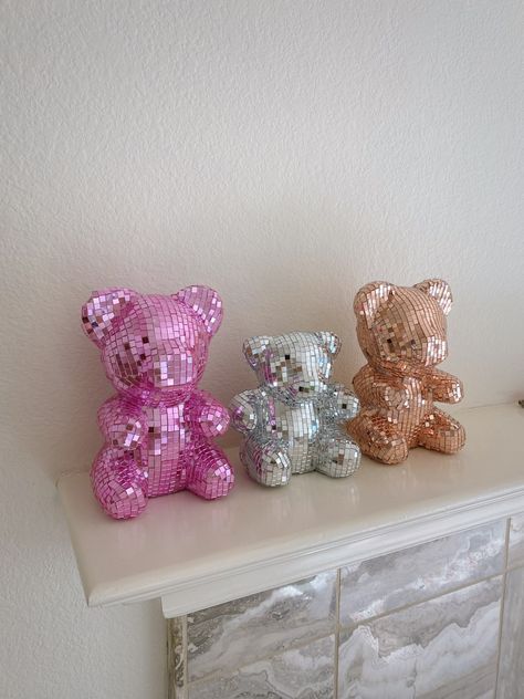 disco gummy bear + disco teddy bear - the perfect dopamine decor pieces for your space 🪩🧸 this is the perfect piece to light up every room - especially when the sun hits & light reflects :) each disco piece is handmade here in California. they are composed of mirror glass tiles that are individually placed to create the ultimate groovy statement home decor piece to your home.  dimensions:  pink: height: 9" x 5" x 6" rose gold / brown: 8" x 5" x 5" silver: 6" x 5" x 4"  custom orders upon reque Thrift Store Room Decor, Pink Things For Room, Gummy Bear Decor, Pink And Gold Room, Y2k Home Decor, Light Pink Decor, Rose Gold Room Decor, Disco Decor, Dream Dorm Room