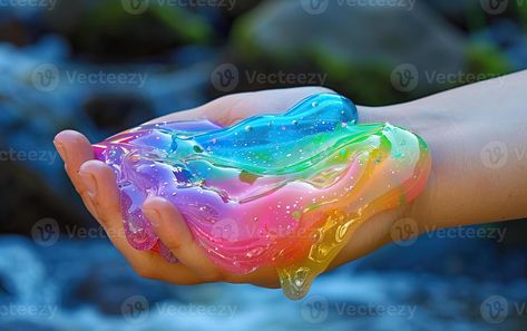 Rainbow glitter slime held in a hand Rainbow Slime, Glitter Slime, Wedding People, Rainbow Glitter, Heart Tree, Cityscape Photos, Logo Banners, Nature Backgrounds, Heart With Arrow