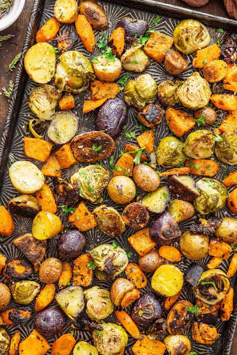 Brussels sprouts, carrots, and potatoes are tossed with olive oil and fresh herbs then roasted to perfection in this Oven Roasted Vegetables recipe. Quick, easy, and you can easily adapt the recipe to include your favorite veggies and herbs. Roasting Vegetables In Oven Recipes, Over Roasted Vegetables, Roasted Vegetables With Brussel Sprouts, Easy Roasted Veggies, Toasted Vegetables In Oven, Veggie Medley Recipes Roasted Vegetables, Roasted Vegetables With Sausage, Roasted Mixed Vegetables Oven, Roast Brussel Sprouts Oven