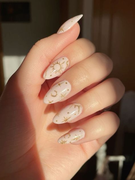 #nails#nailart#witchyvibes#witchy#witch#moon#stars#acrylicnaildesigns#naildesign more in telegram Almond Nails Stars And Moon, Short Almond Nails Celestial, Short Nail Designs Celestial, White Witchy Nails, White Nails With Stickers, Celestial Nail Art Simple, Nails Moon Design, Nails Moon Stars, Nails With Moon Design